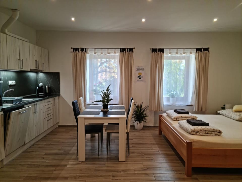 Bed, Kitchen or kitchenette, Dining area, stove, towels