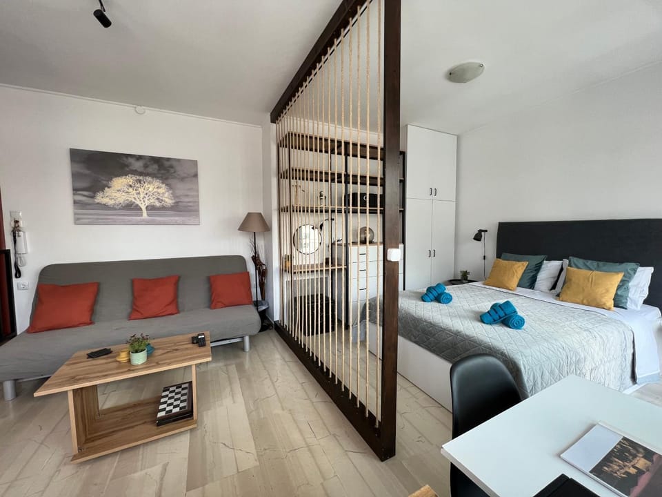 Bed, Living room, Seating area, Bedroom