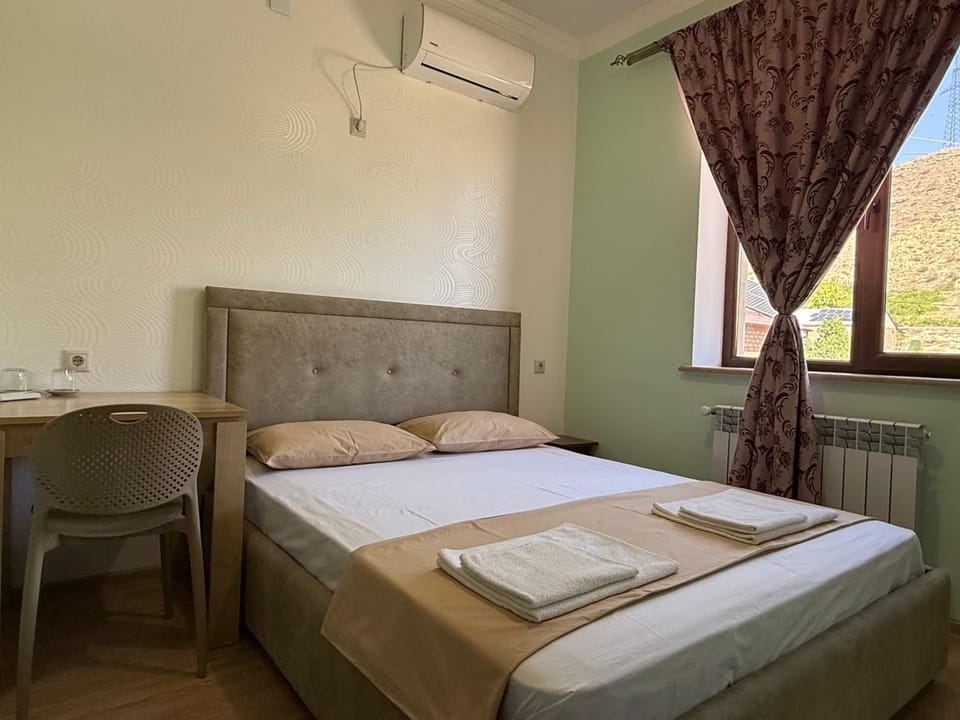 Bed, Photo of the whole room, Bedroom, towels, air conditioner