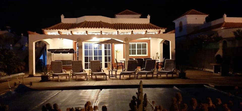 Property building, Patio, Night, Pool view, Swimming pool, sunbed