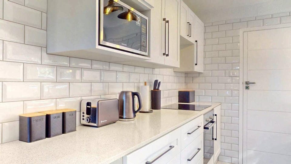 Kitchen or kitchenette, microwave, oven, stove, toaster
