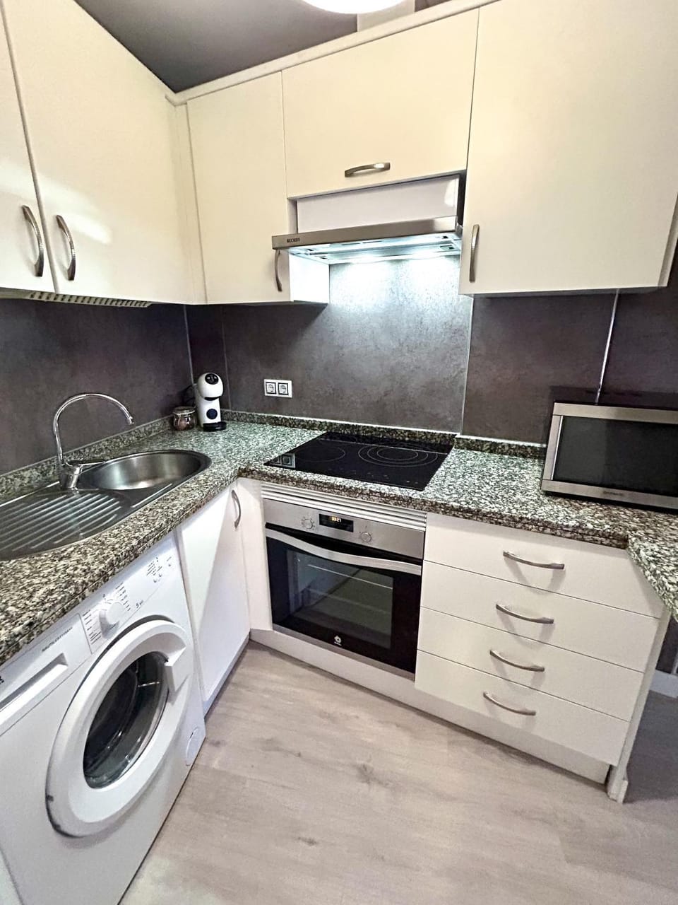 Kitchen or kitchenette, stove, washing machine