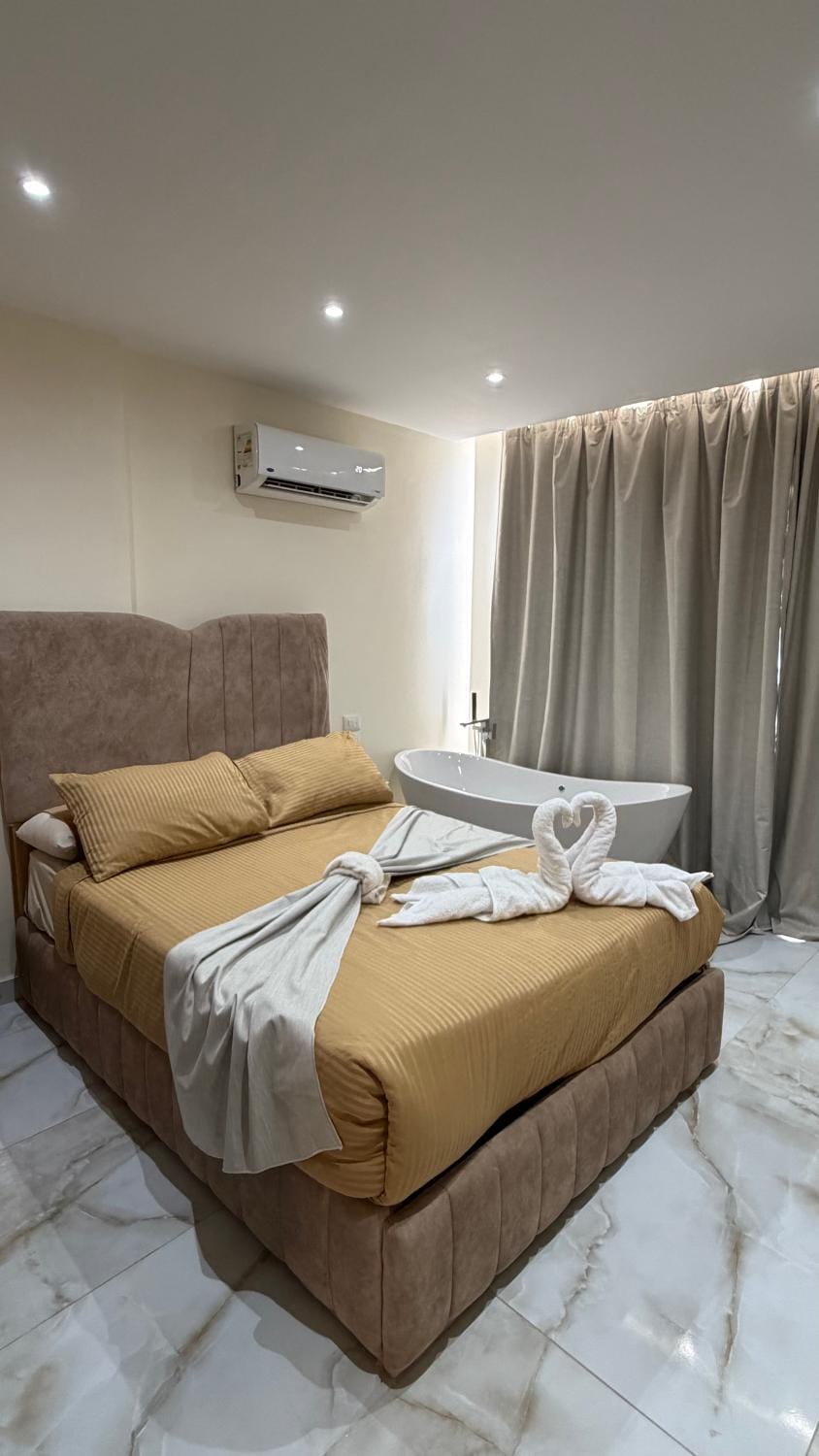 Bed, Photo of the whole room, Bedroom, towels, air conditioner