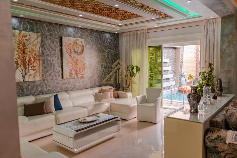Living room, Seating area, Pool view