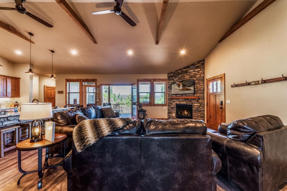 View (from property/room), Kitchen or kitchenette, Living room, Seating area, fireplace, furniture