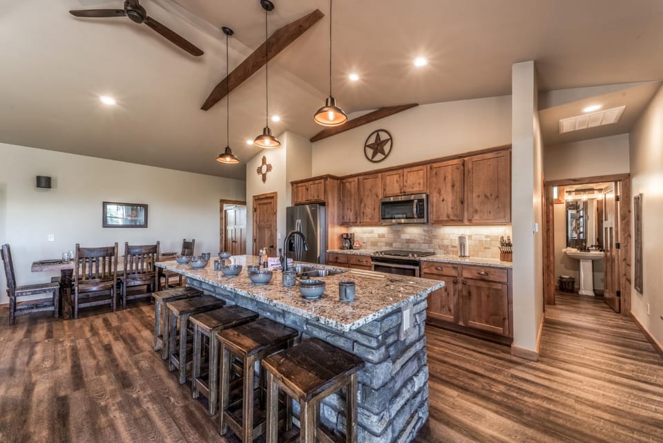 Kitchen or kitchenette, Seating area, Dining area, furniture, microwave, oven, stove