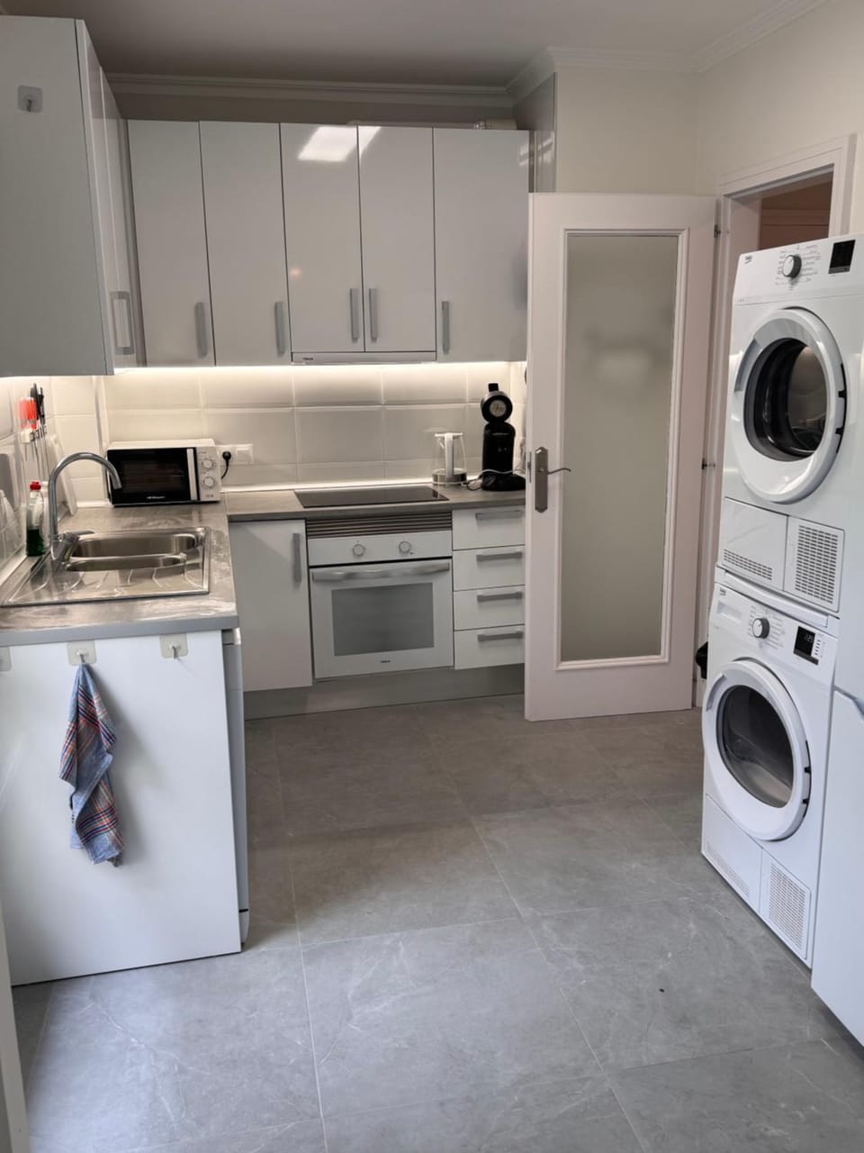 Kitchen or kitchenette, dishwasher, stove, dryer