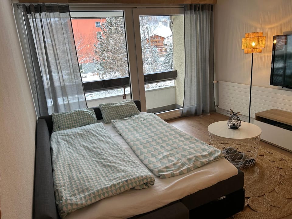 Bed, TV and multimedia, Living room, Seating area