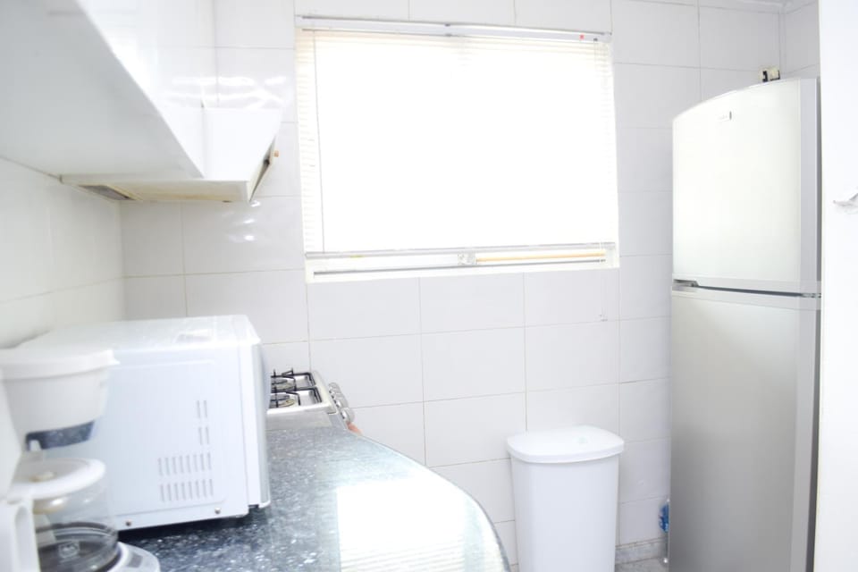 Kitchen or kitchenette, microwave, oven, stove, air conditioner