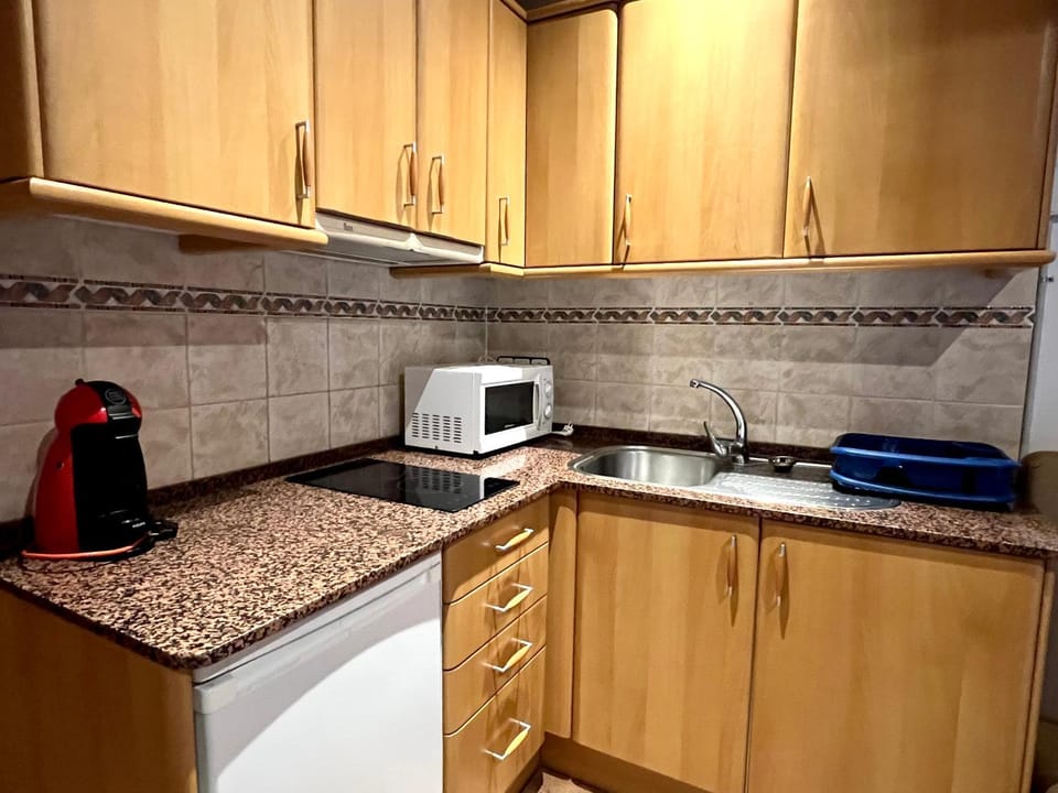 Kitchen or kitchenette, oven, stove