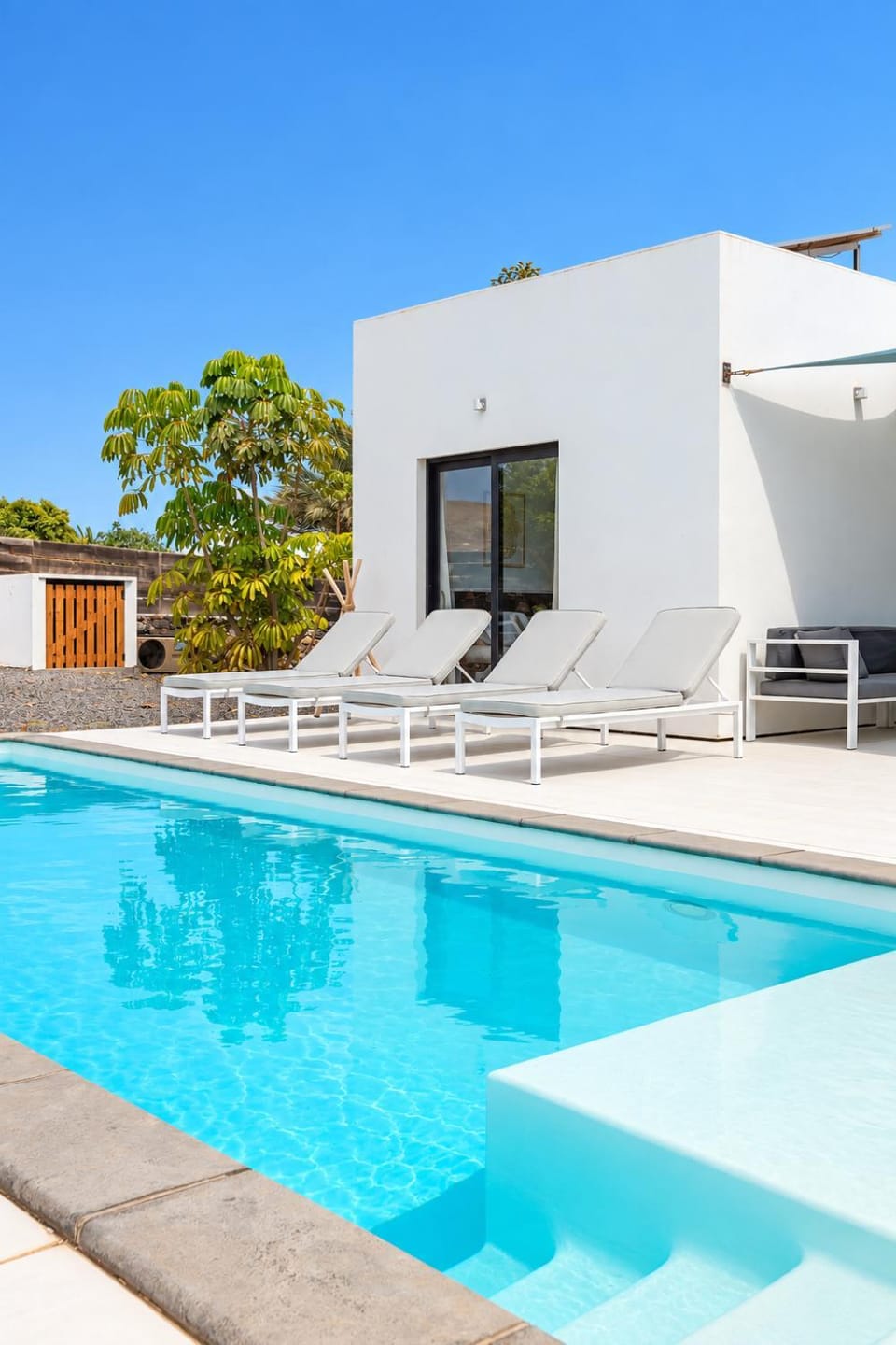 Property building, Patio, Swimming pool, sunbed