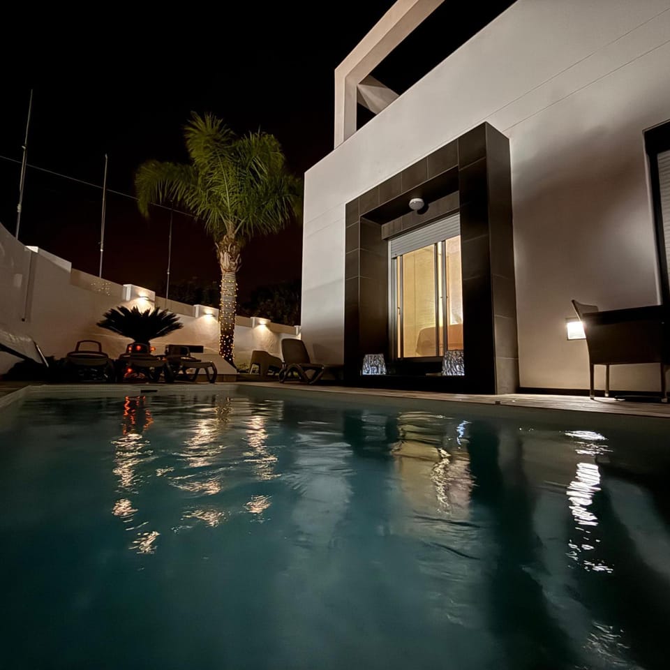 Property building, Living room, Swimming pool
