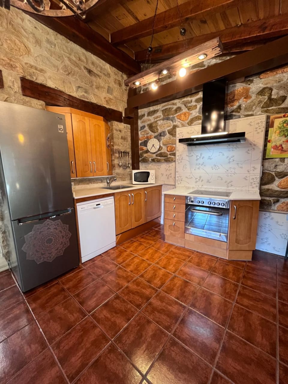 Kitchen or kitchenette, dishwasher, oven, stove