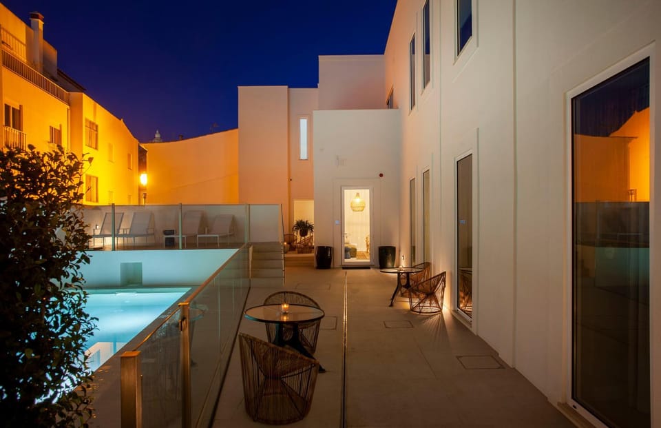 Property building, Patio, Night, Balcony/Terrace, Pool view, Swimming pool, pet friendly, sunbed