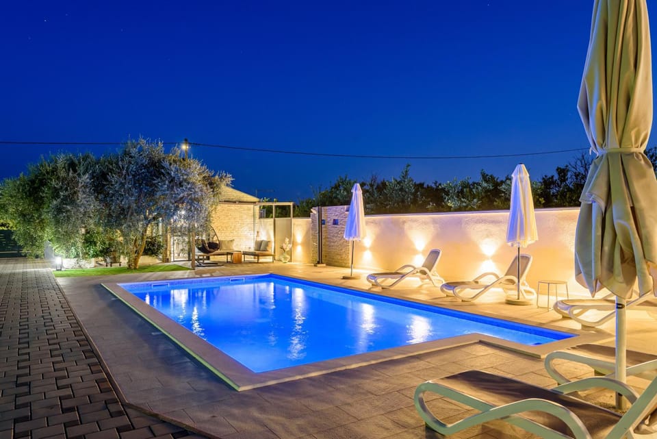 Patio, Night, Natural landscape, Pool view, sunbed