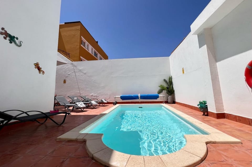 Property building, Living room, Swimming pool