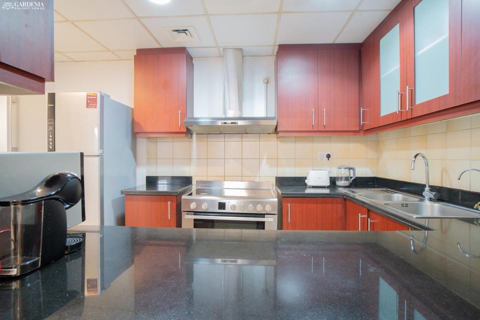 Kitchen or kitchenette, dishwasher, oven, stove, toaster