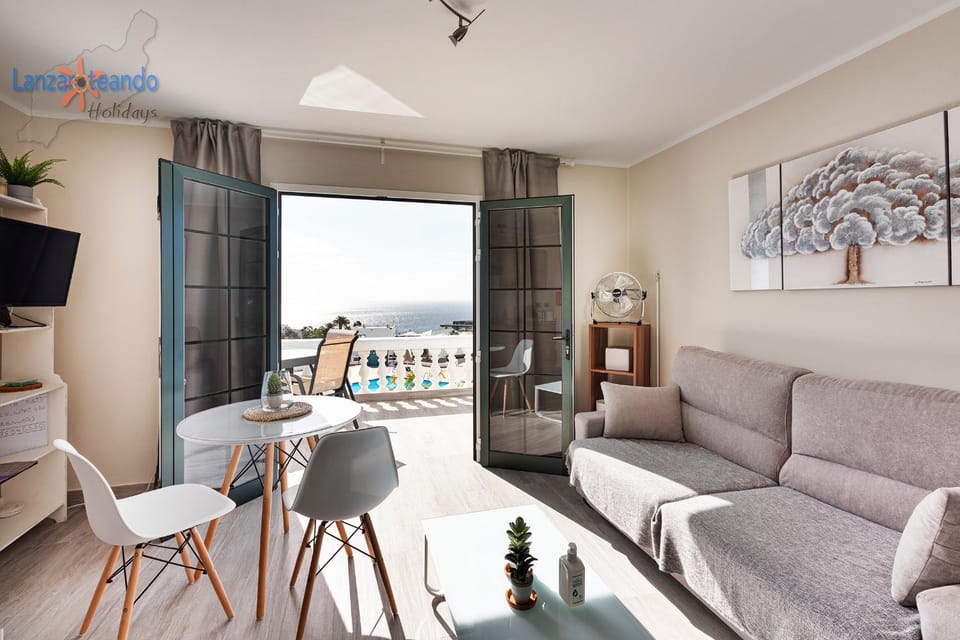 View (from property/room), Balcony/Terrace, Living room, Pool view, Sea view