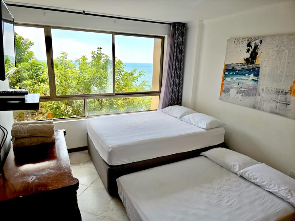 Bed, Decorative detail, Guests, Sea view, furniture, towels, air conditioner