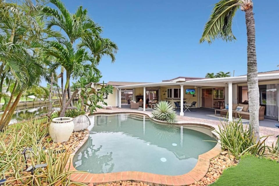 Home wpool by Dream Vacation OP Canal House in Oakland Park