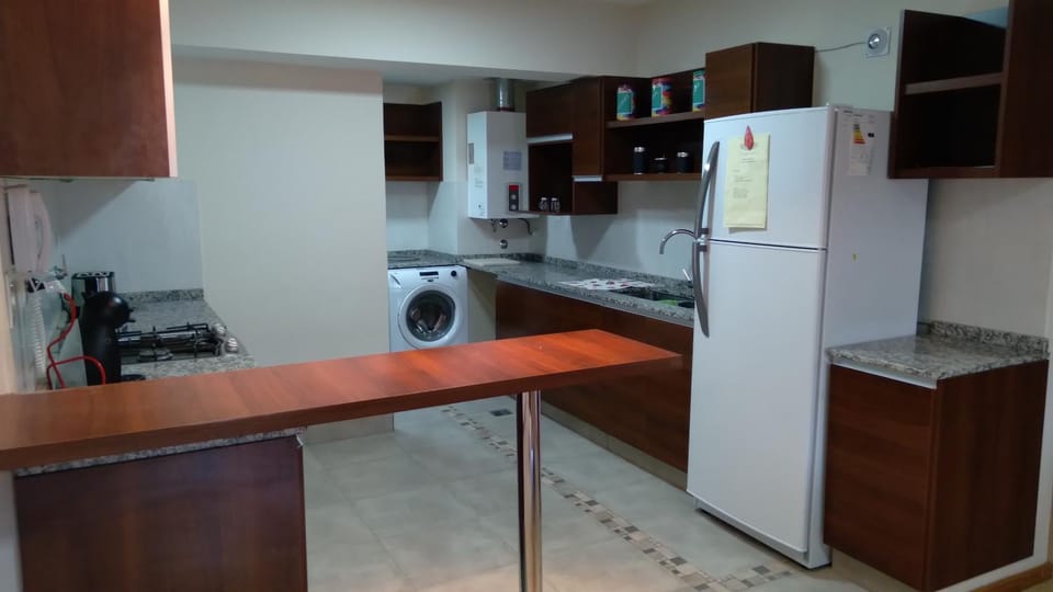 Kitchen or kitchenette, stove, washing machine