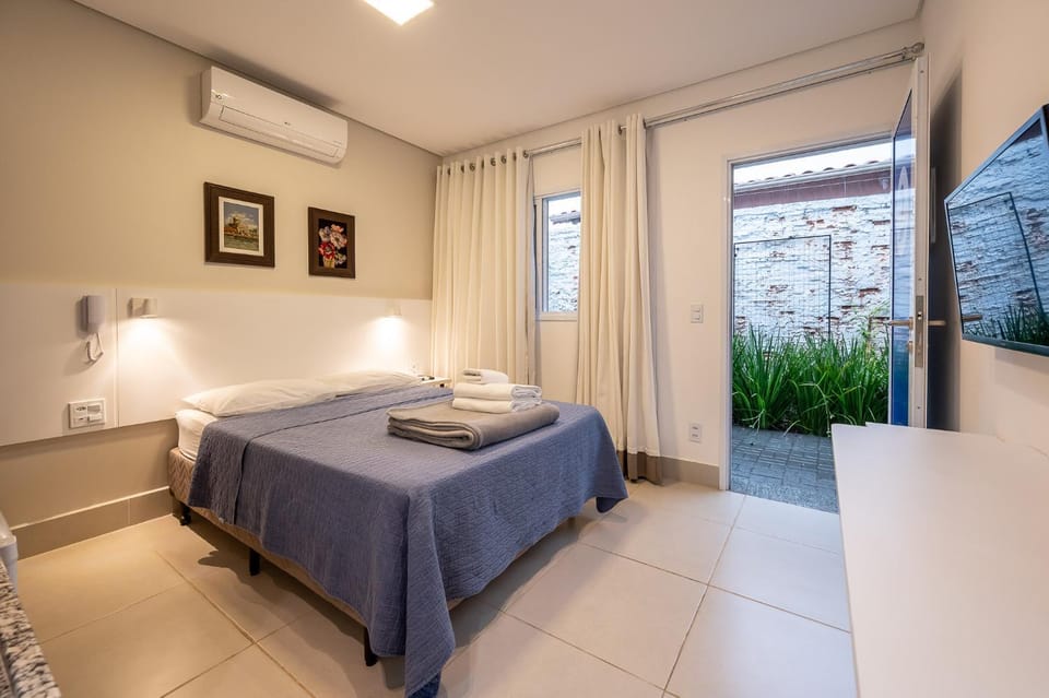 Photo of the whole room, Bedroom, towels, air conditioner