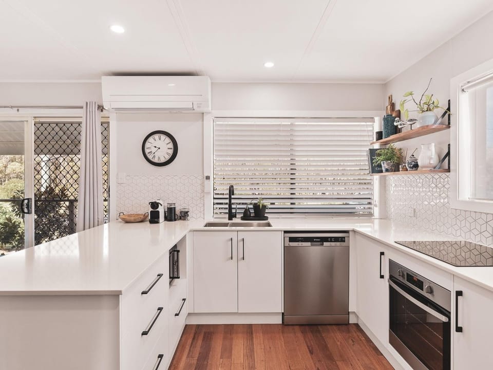 Kitchen or kitchenette, dishwasher, oven, stove