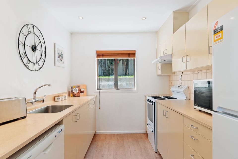Kitchen or kitchenette, dishwasher, oven, stove
