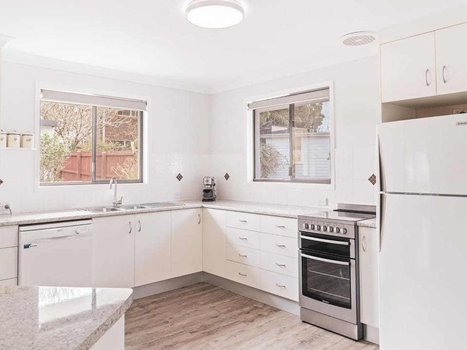 Kitchen or kitchenette, dishwasher, oven, stove