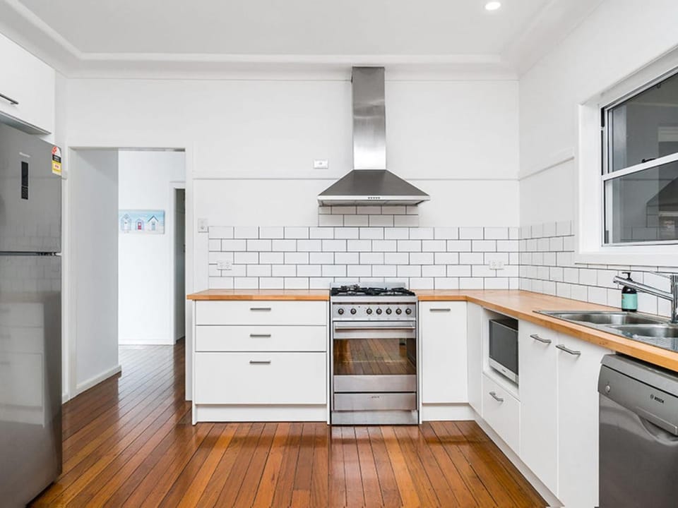 Kitchen or kitchenette, dishwasher, oven, stove