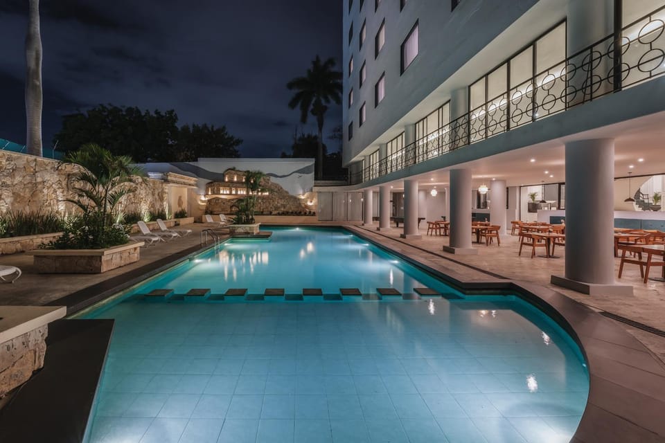 Property building, Patio, Night, Pool view, Swimming pool, Swimming pool, sunbed