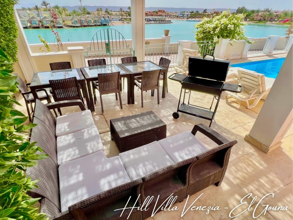 Property building, Patio, Day, Natural landscape, View (from property/room), Seating area, Dining area, Lake view, Mountain view, Pool view, Swimming pool, sunbed