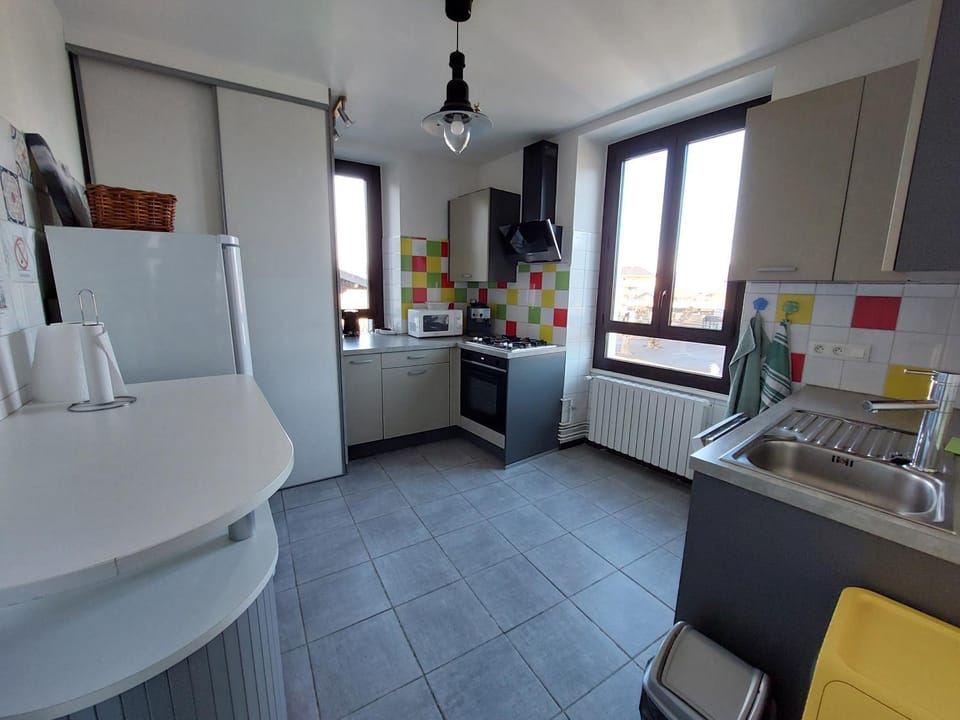 Kitchen or kitchenette, dishwasher, oven, stove