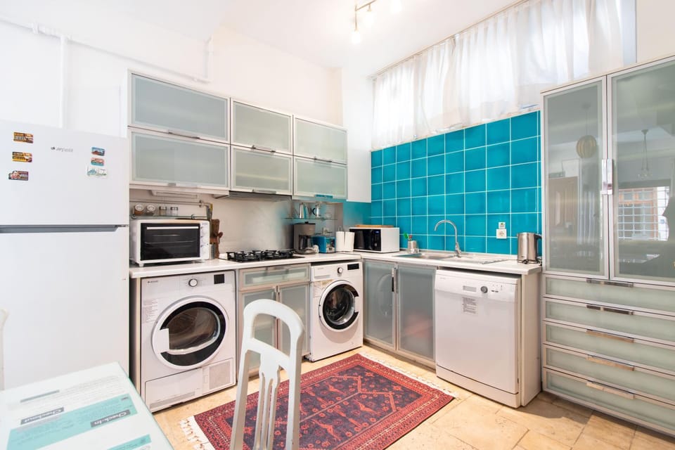 Kitchen or kitchenette, dishwasher, oven, stove, toaster, washing machine, dryer