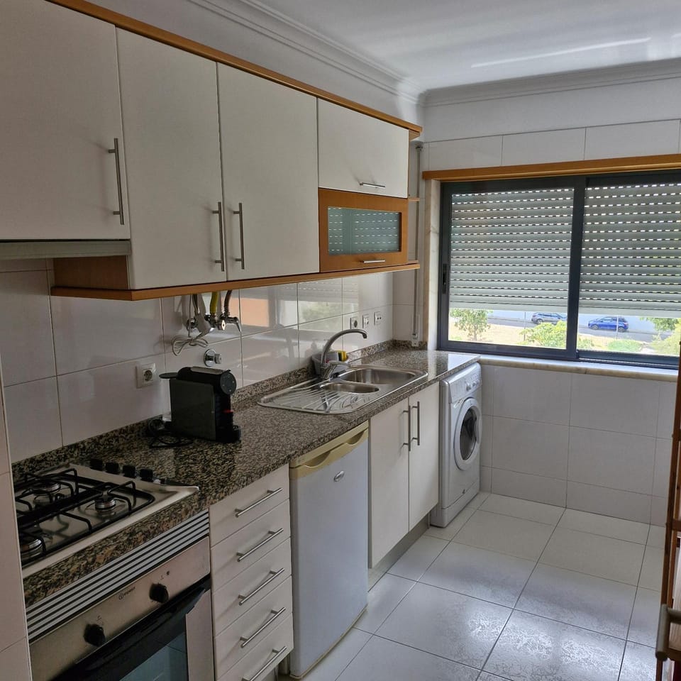 Kitchen or kitchenette, stove, washing machine