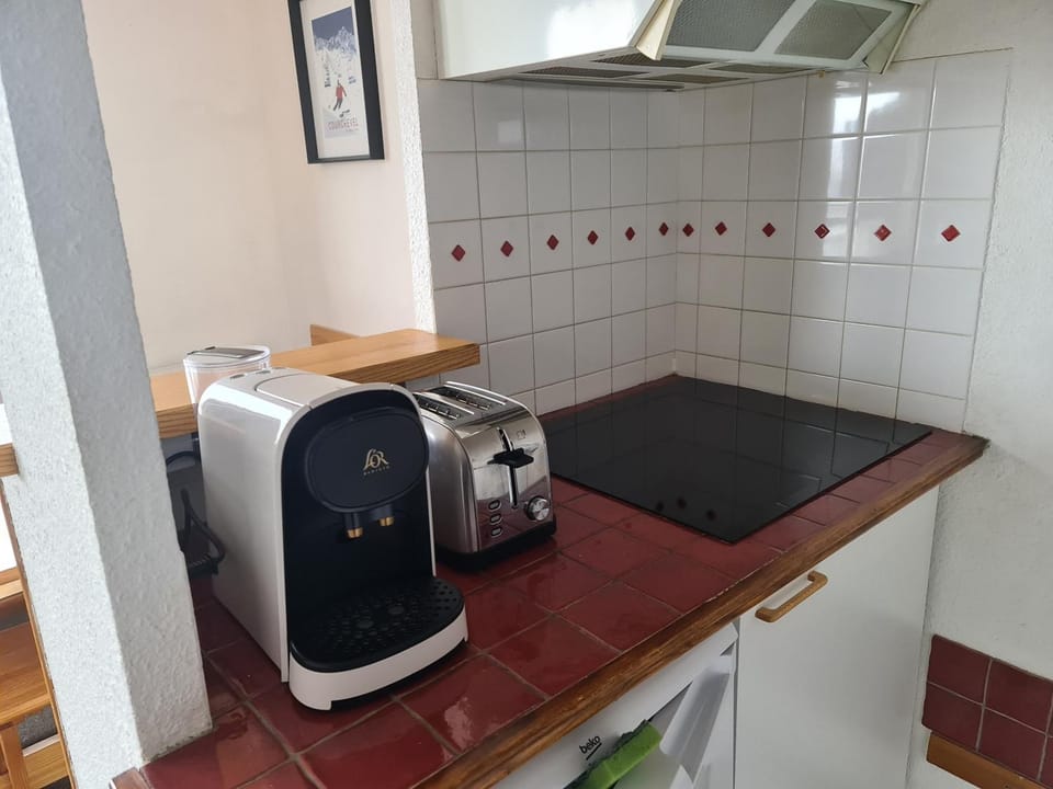 Kitchen or kitchenette, stove, toaster