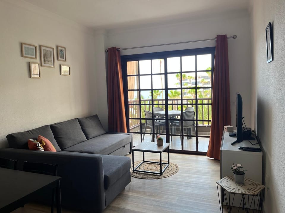 TV and multimedia, View (from property/room), Living room, Seating area, Pool view, Sea view