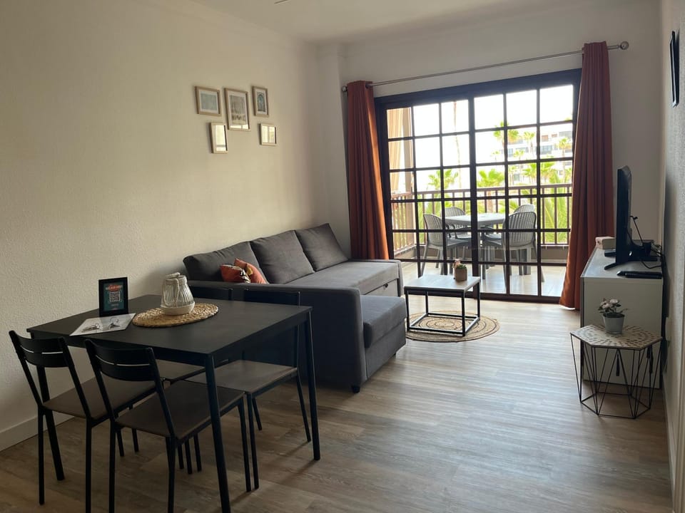 TV and multimedia, Living room, Seating area, Pool view, Sea view