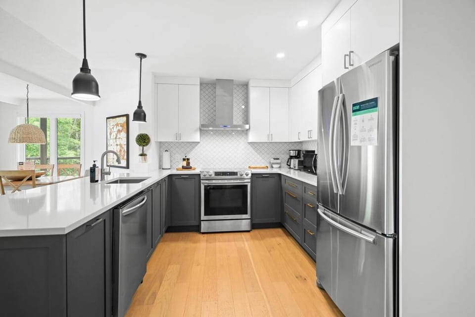 Kitchen or kitchenette, dishwasher, oven, stove