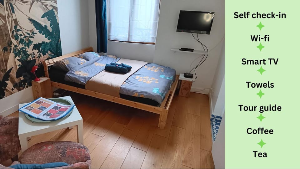 Le chic Audonien - Cozy Nest before Gates of Paris - Access from CDG & Orly airports - Wi-Fi - Smart TV Apartment in Saint-Denis, France