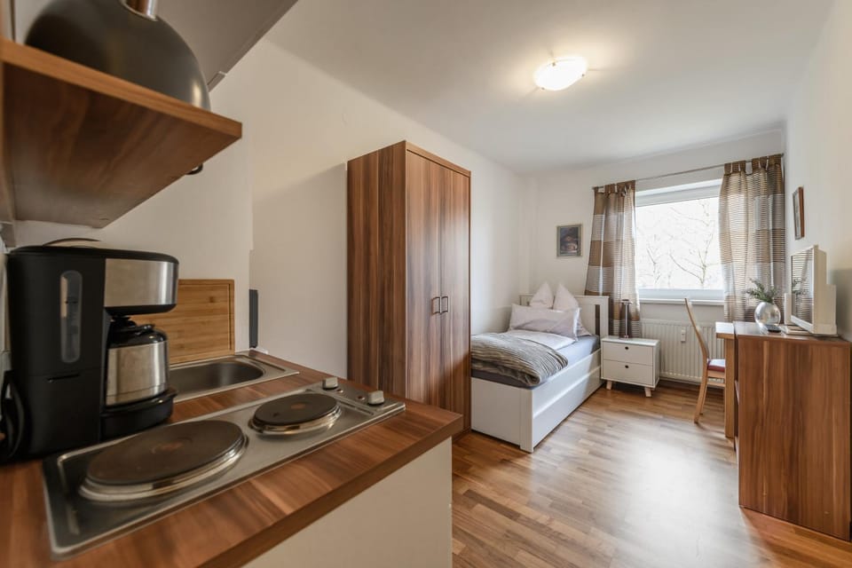 Bed, Photo of the whole room, Seating area, Bedroom, stove