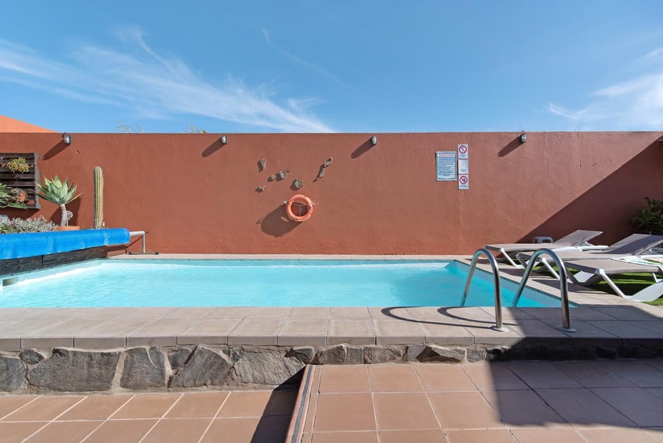 Property building, Living room, Swimming pool