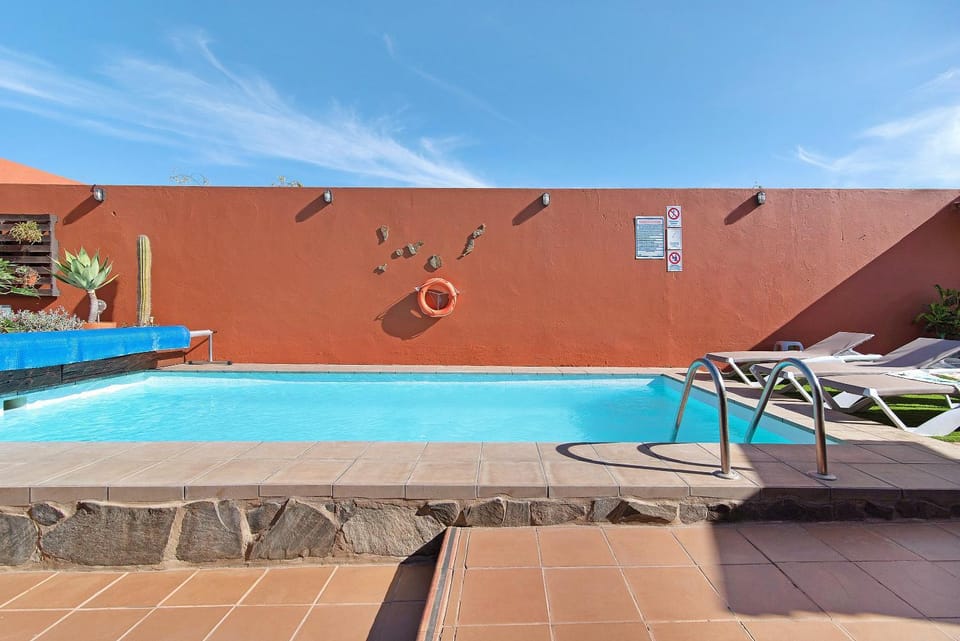 Property building, Living room, Swimming pool