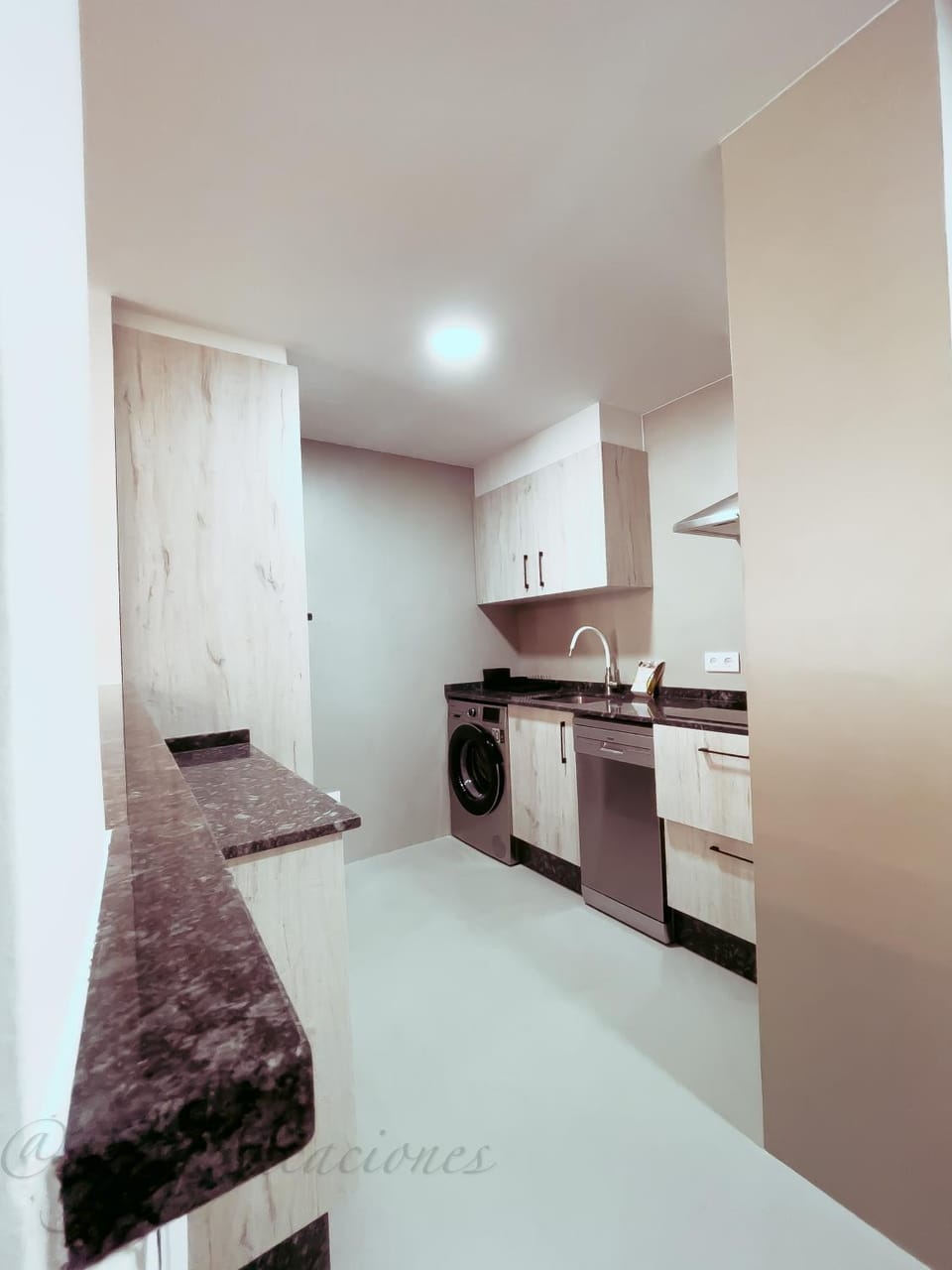 Kitchen or kitchenette, dishwasher, oven, stove, washing machine