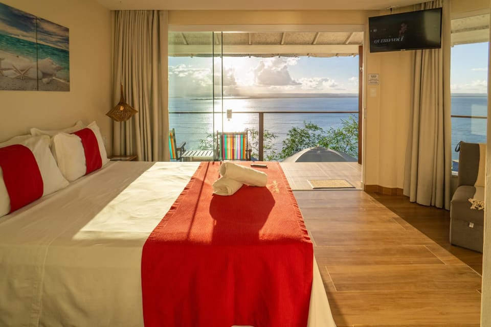 Bed, Natural landscape, TV and multimedia, View (from property/room), Balcony/Terrace, Photo of the whole room, Bedroom, Sea view, Sunset, towels