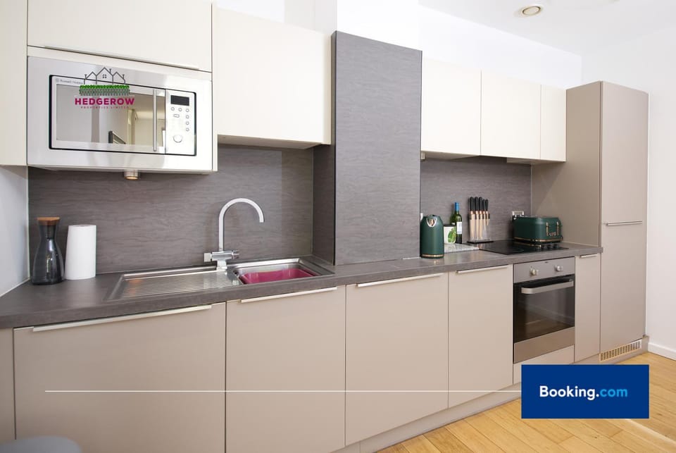 Kitchen or kitchenette, dishwasher, stove, toaster
