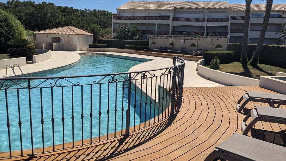 Property building, Patio, Day, Natural landscape, View (from property/room), Pool view, Swimming pool, sunbed