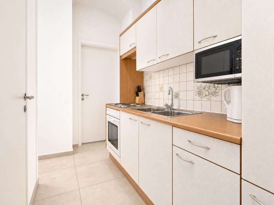 Kitchen or kitchenette, oven, stove