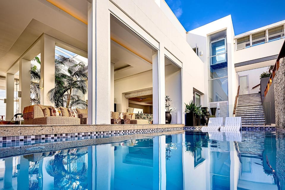 Property building, Patio, Day, Decorative detail, Seating area, Pool view, Swimming pool, sunbed