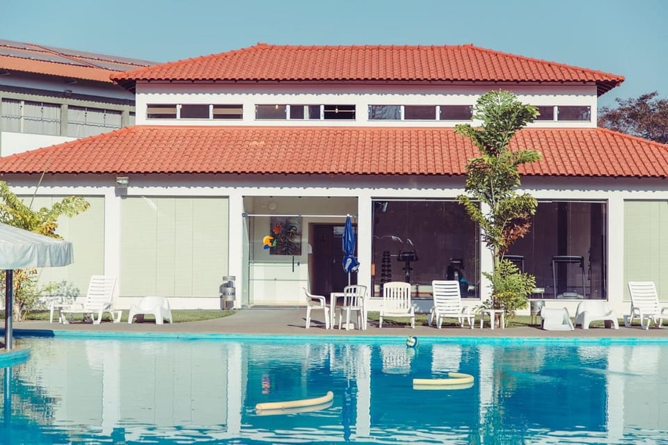 Property building, Day, Pool view, Swimming pool, sunbed